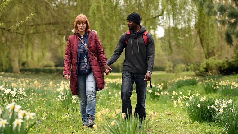Visitors in the garden in spring at Belton House, Lincolnshire